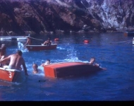 This shows rowboats in Cherry Cove. They were orange then and we joked about orange stripes on the yachts in the cove.
